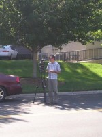 Derrick and his camera across South Saint mary's Street from the Visitors Center